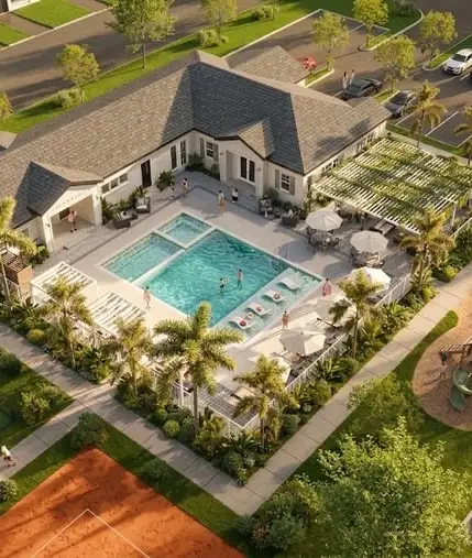 Aerial view of homes surrounding an outdoor swimming pool at Aurora Oaks.