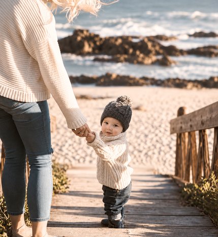 A family walking beside Georgian Bay.