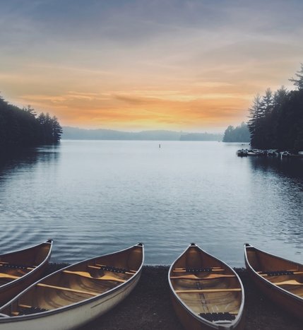 Canoes on the water at Crescent Bay.