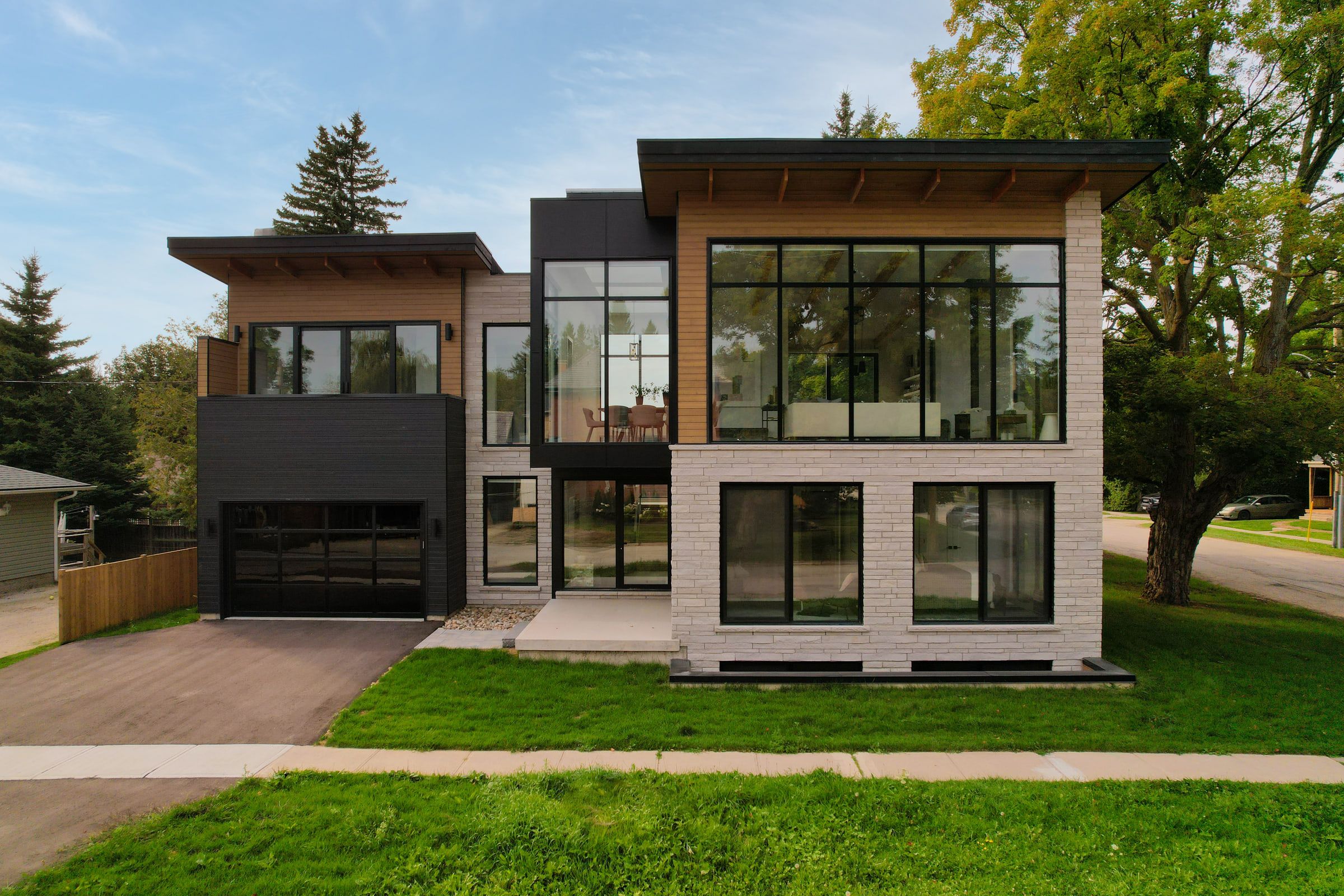 Straight-on summer view of the complete front elevation of 41 Alice Street, framed by trees.