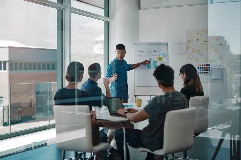 Colleagues working together in a bright office.